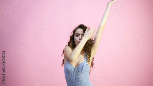 Funny portrait of hipster girl. Crazy young woman having fun, air kiss. Young beautiful teen girl wearing casual fun clothes, excited crazy and amazed for success with arms raised. Teenager love.