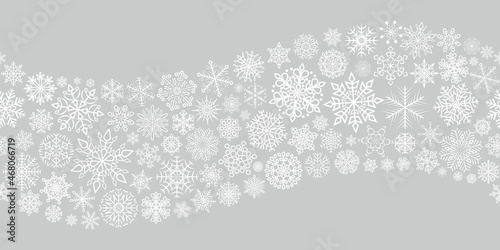 Seamless snowflakes pattern for Christmas and New year postcards or greetings. Winter background of snowflakes.