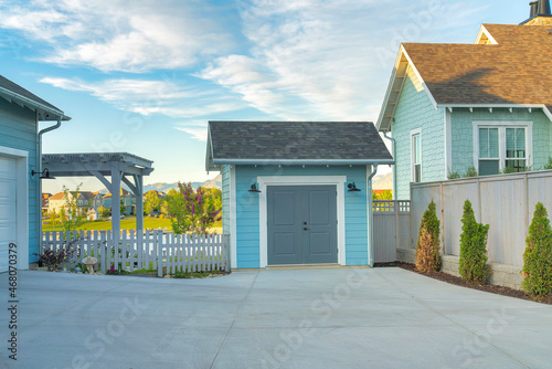Light blue storage shed outside a house at Daybreak, Utah