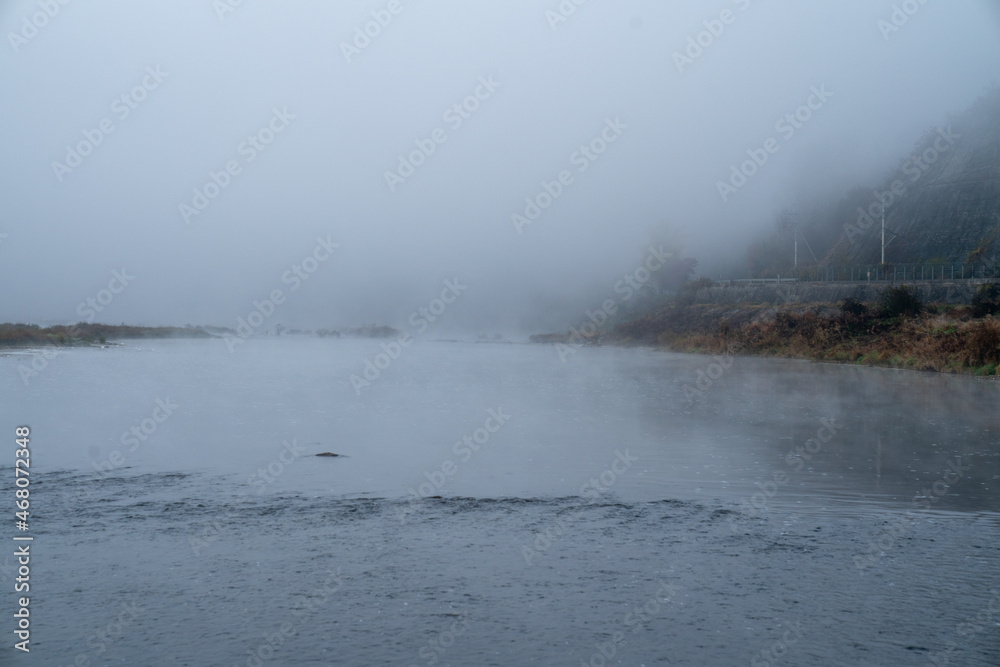 The view of the early autumn morning when the water fog rises The view of the early autumn morning when the water fog rises