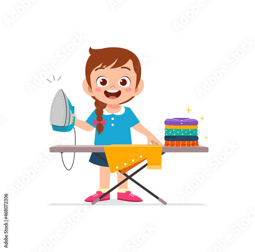 little girl use electric iron to smooth clothes