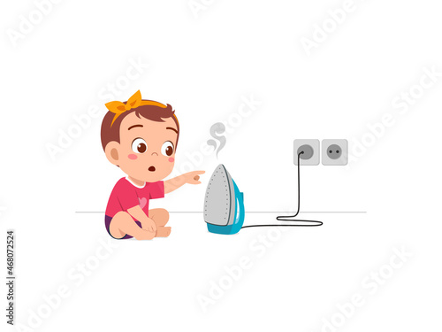 little baby curious to touch hot electric iron