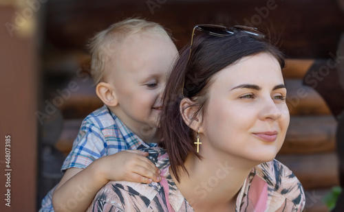 Portrait of a happy mom being hugged by her little son © Дворецкая Таня