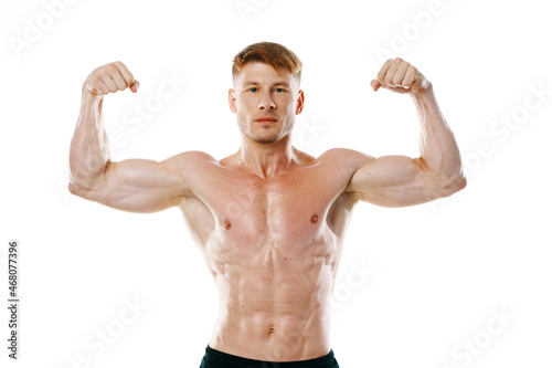 male athlete with pumped up muscular body posing fitness