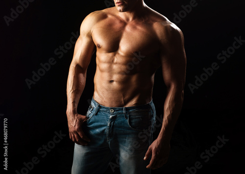 Sexy guy man on black. Handsome fitness young bodybuilder with naked torso. Bare abs guy. Sexual muscular male. Homosexual pride, lgbtq lgbt.