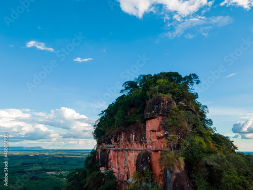 Aerial view of Beautiful mountain landscape with adventure wooden bridge on red stone cliff in blue sky of Wat Phu Thok temple, at Bueng Kan province amazing Thailand.