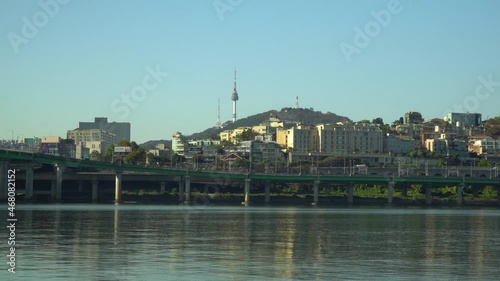 Zoom in to N Seoul Tower or Namsan Tower from Han river riverbank on cloudless autumn day, Yongsan -ru, Seoul South Korea  realtime 4k photo