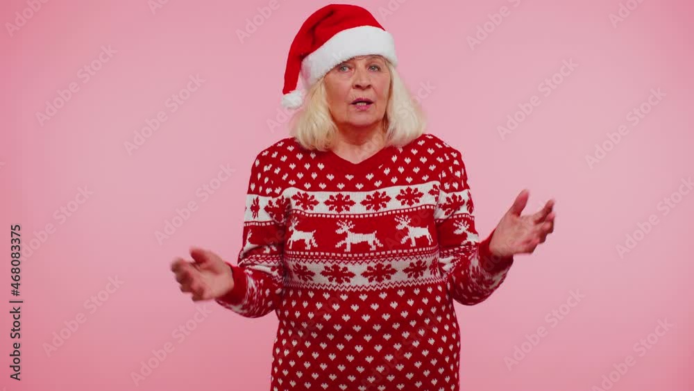 I dont know what to say. Confused senior grandmother woman feeling embarrassed about ambiguous question, having doubts, no idea, being clueless and uncertain on pink background. Happy New Year holiday I dont know what to say. Confused senior grandmother woman feeling embarrassed about ambiguous question, having doubts, no idea, being clueless and uncertain on pink background. Happy New Year holiday