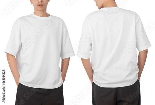 Canvas Print Young man in blank oversize t-shirt mockup front and back used as design template, isolated on white background with clipping path