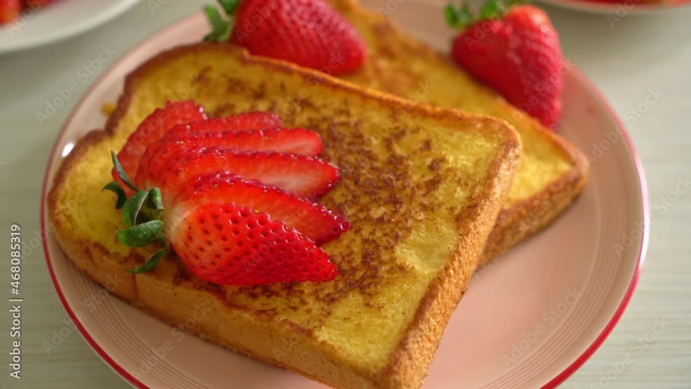 french toast with fresh strawberry on plate