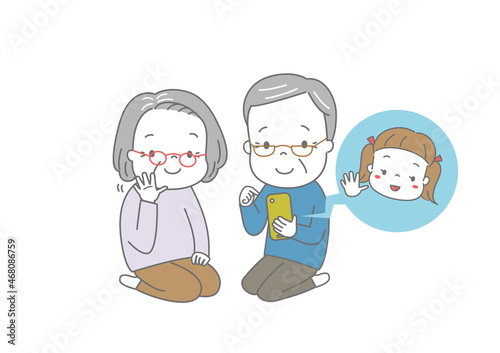 孫とビデオ通話を楽しむおじいさん、おばあさん