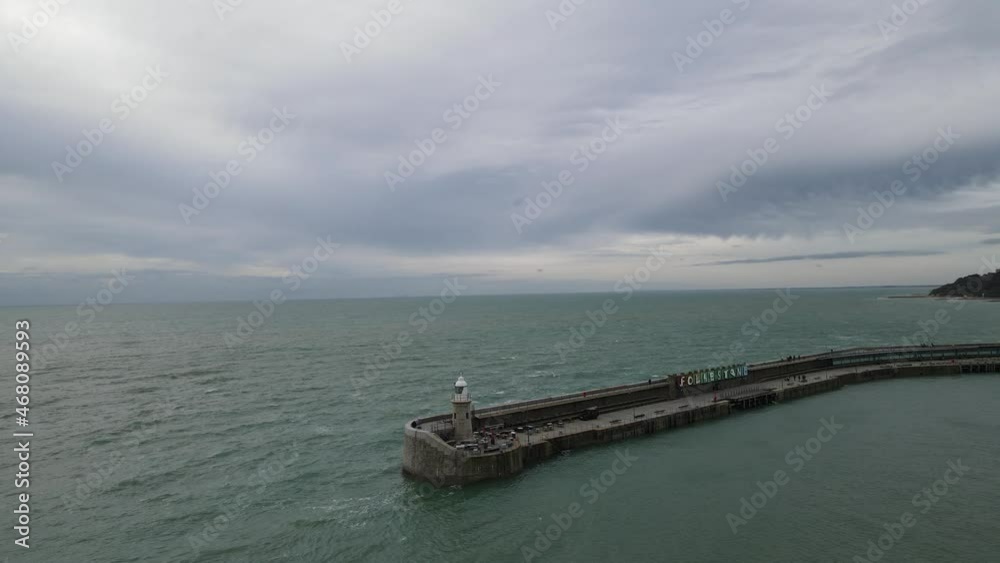 Lighthouse on harbour arm with name Lighthouse on harbour arm with name