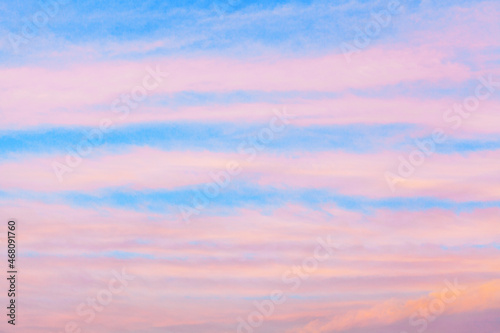 Fototapeta Naklejka Na Ścianę i Meble -  Pink сirrus clouds blue sky background closeup, red dawn cirrostratus cloud texture, purple evening sunset, morning sunrise clouds, striped cloudy skies, cloudscape, beautiful heaven view, cloudiness
