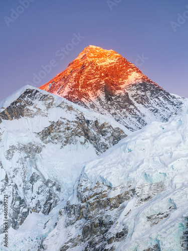 view to Mount Everest in sunset light under blue sky in vertical frame in giant resolution