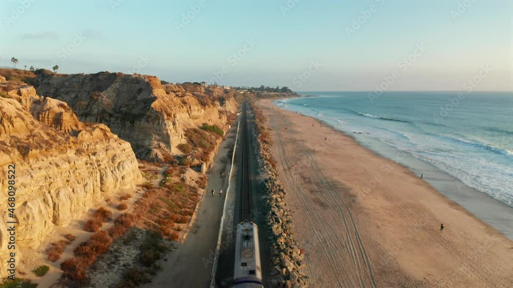 Aerial view of an Amtrak train passing under in San Clemente California Aerial view of an Amtrak train passing under in San Clemente California