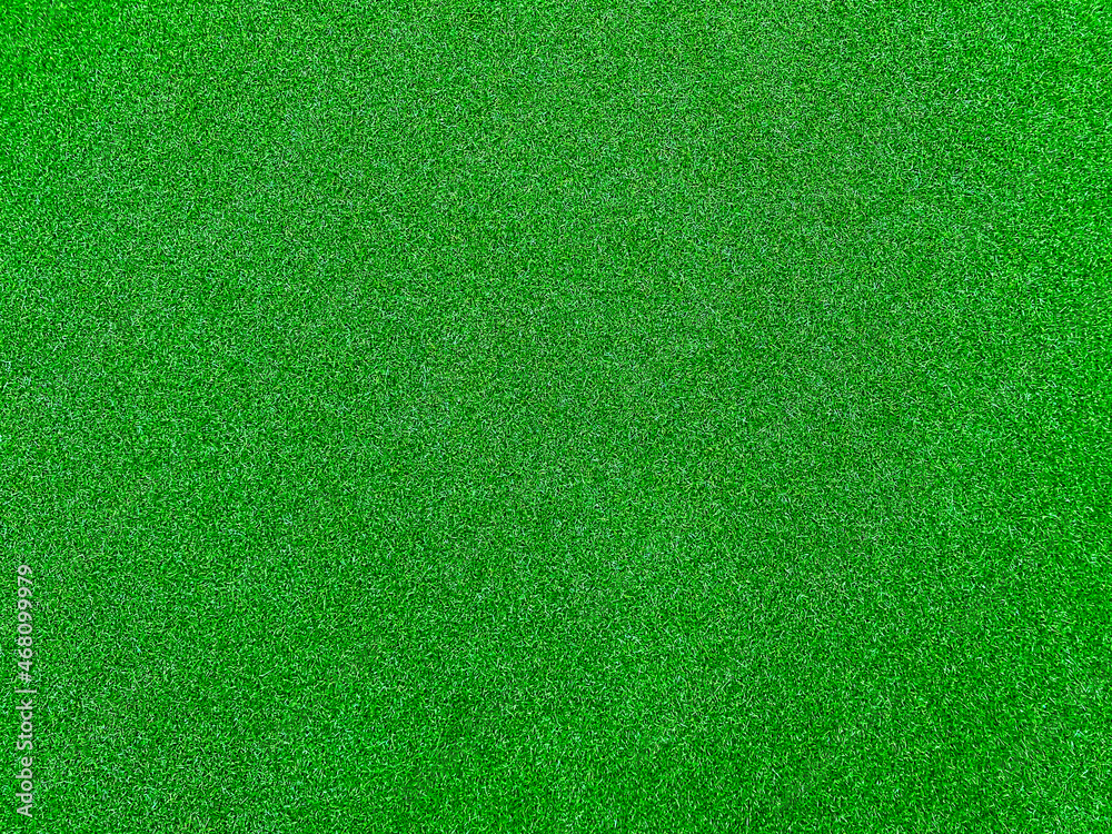 Green grass texture background grass garden top view. Concept used for making green background football pitch, Grass Golf,  green lawn pattern textured background.