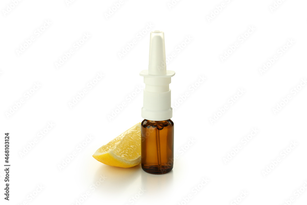 Blank bottle of nasal spray and lemon slice isolated on white background Blank bottle of nasal spray and lemon slice isolated on white background