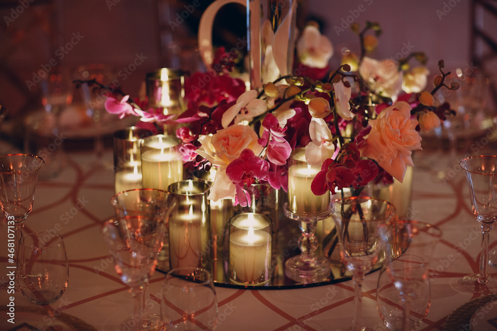 Wedding decor table with white flowers and candles.