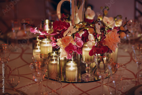 Wedding decor table with white flowers and candles.