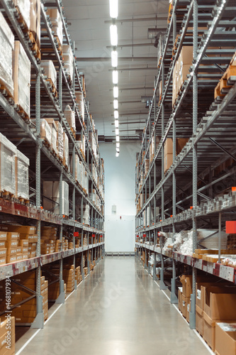 Huge distribution warehouse with high shelves. Warehouse interior.