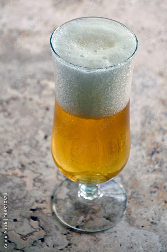 A glass of kolsch beer on the table A glass of kolsch beer on the table