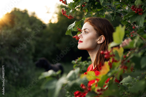 Cuadro en lienzo woman in red dress green leaves nature freedom summer