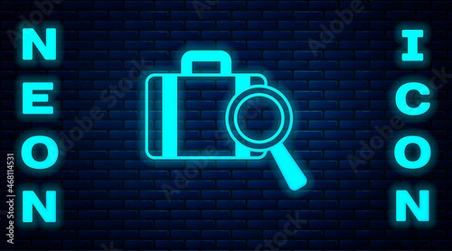 Glowing neon Airline service of finding lost baggage icon isolated on brick wall background. Search luggage. Vector
