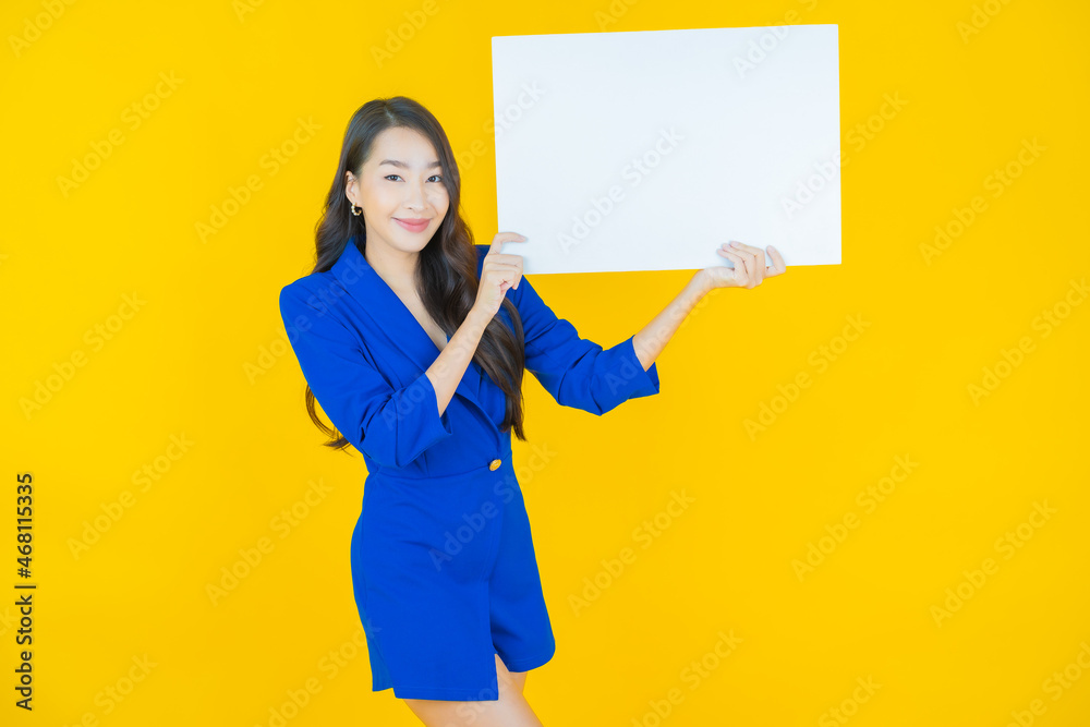 Portrait beautiful young asian woman with empty white billboard Portrait beautiful young asian woman with empty white billboard