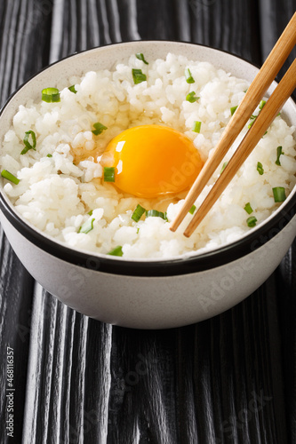Obraz na plátně Tamago kake gohan is a popular Japanese breakfast food consisting of cooked Japanese rice topped with raw egg close up in the bowl on the table