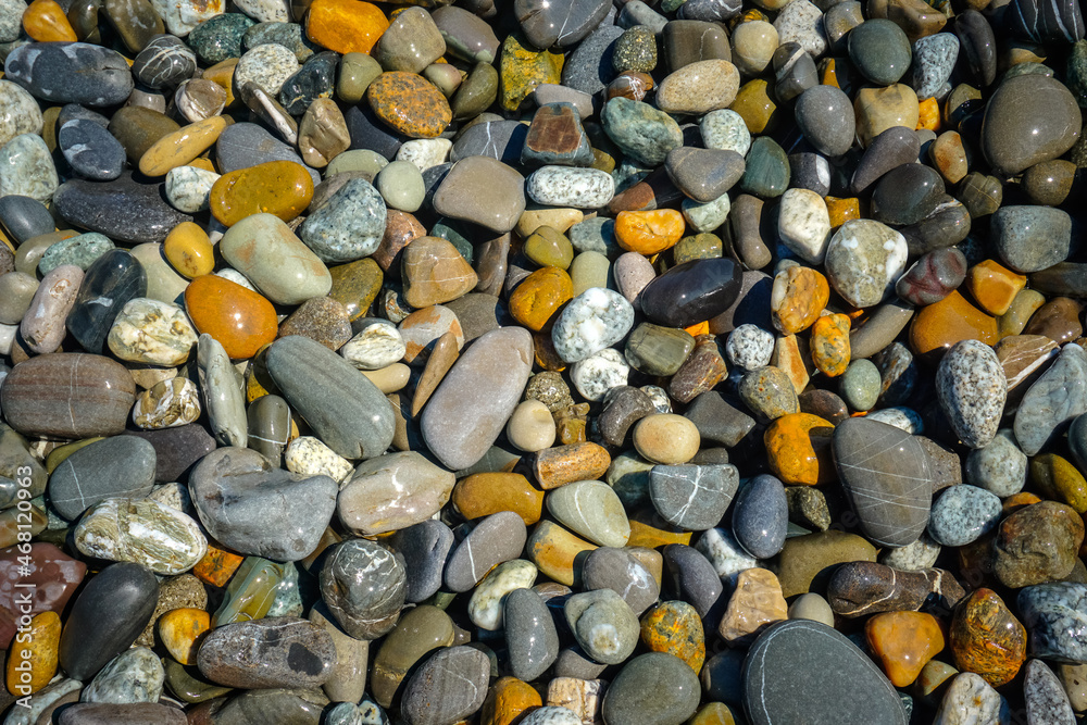 Multi colored pebbles on the beach Multi colored pebbles on the beach