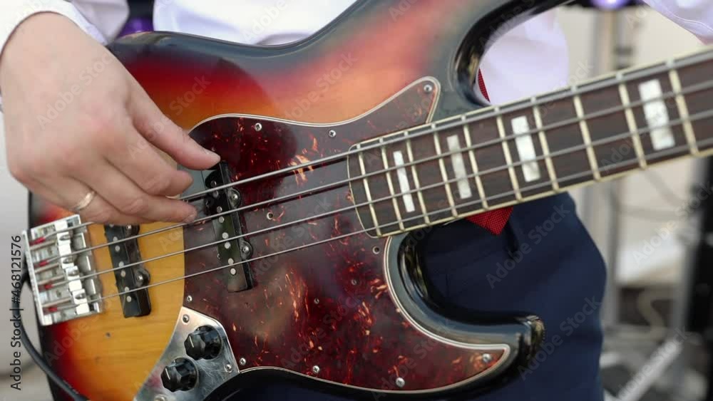 Musician playing the guitar during a live performance Musician playing the guitar during a live performance