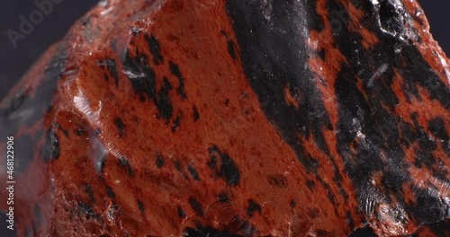 Obsidian mahogany. Igneous rock. Close-up stone texture. photo