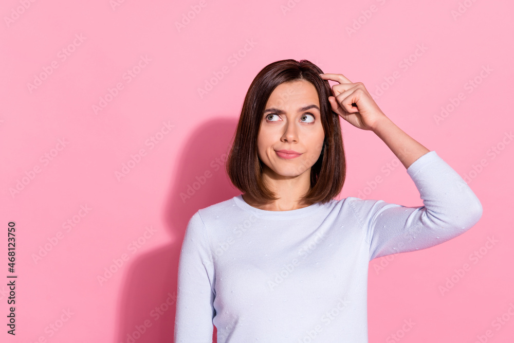 Photo of unsure thoughtful young woman wear white sweater finger head forget important thing isolated pink color background - obrazy, fototapety, plakaty 