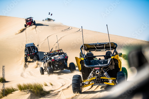 Fototapeta Naklejka Na Ścianę i Meble -  Doha,Qatar,February 23, 2018, Off road buggy car in the sand dunes of the Qatari desert