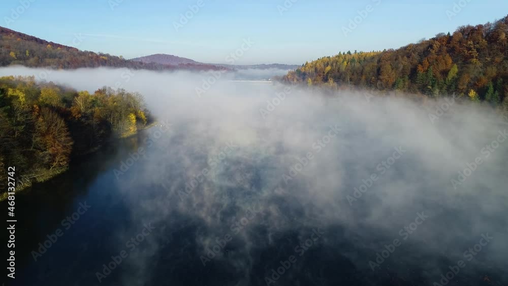 Aerial view of river with morning fog, flowing among the mountains. Aerial view of beautiful colorful fall landscape. Autumn in mountains, epic aerial vista. Aerial view of river with morning fog, flowing among the mountains. Aerial view of beautiful colorful fall landscape. Autumn in mountains, epic aerial vista.
