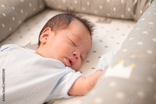 Baby sleeping on bed