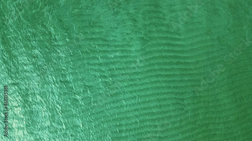 Wallpaper Mural Top-down view of the ocean surface. Bird eye view of emerald green ocean water surface Torontodigital.ca