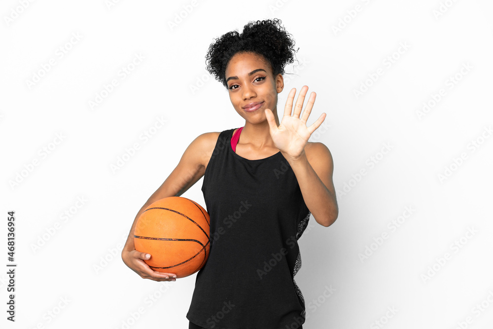 Young basketball player latin woman isolated on white background counting five with fingers