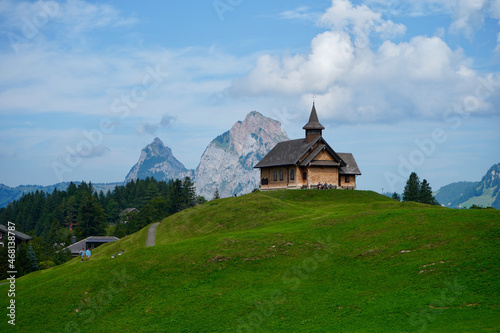 View of a small chapel in front of a Kleiner Mythen mountain in Muotathal, Switzerland photo