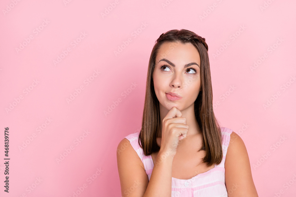 Photo of young lady hand touch chin thoughtful minded plan intelligent isolated over pink color background Photo of young lady hand touch chin thoughtful minded plan intelligent isolated over pink color background