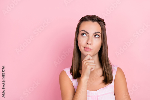 Photo of young lady hand touch chin thoughtful minded plan intelligent isolated over pink color background