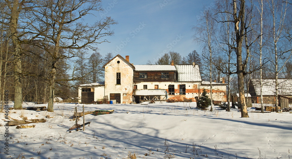 Old white building on a sunny winter day, Pelci, Latvia. Old white building on a sunny winter day, Pelci, Latvia.