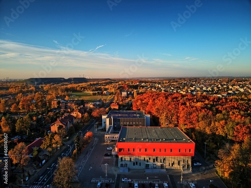 Obraz na płótnie sports and entertainment hall, mining heap and blue sky over the town of Rybnik w salonie