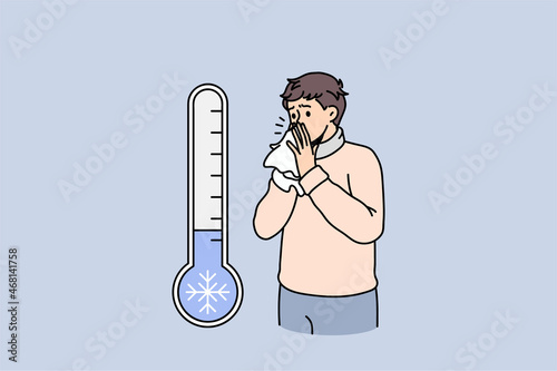 Unhealthy man blow running nose suffer from cold or fever due to cold winter outside temperature. Unwell sick male struggle with seasonal influenza or covid-19. Healthcare. Vector illustration. 