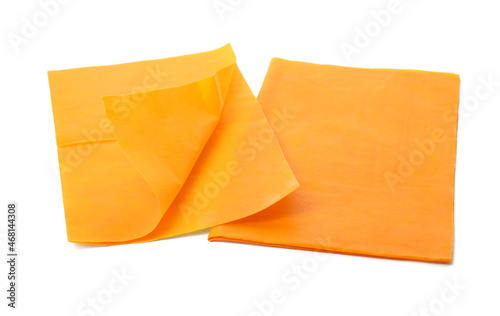 Orange reusable beeswax food wraps on white background
