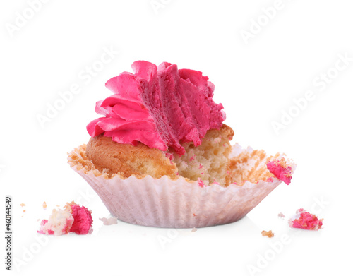 Failed cupcake with cream on white background. Troubles happen photo