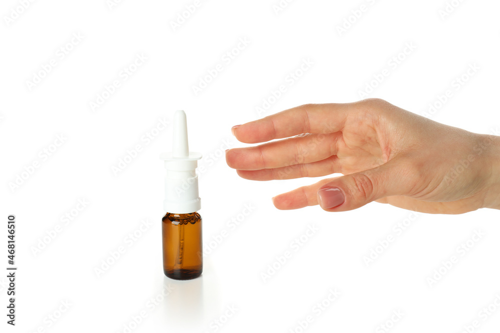 Female hand takes bottle of nasal spray, isolated on white background Female hand takes bottle of nasal spray, isolated on white background
