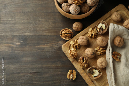 Concept of healthy food with walnuts on wooden background