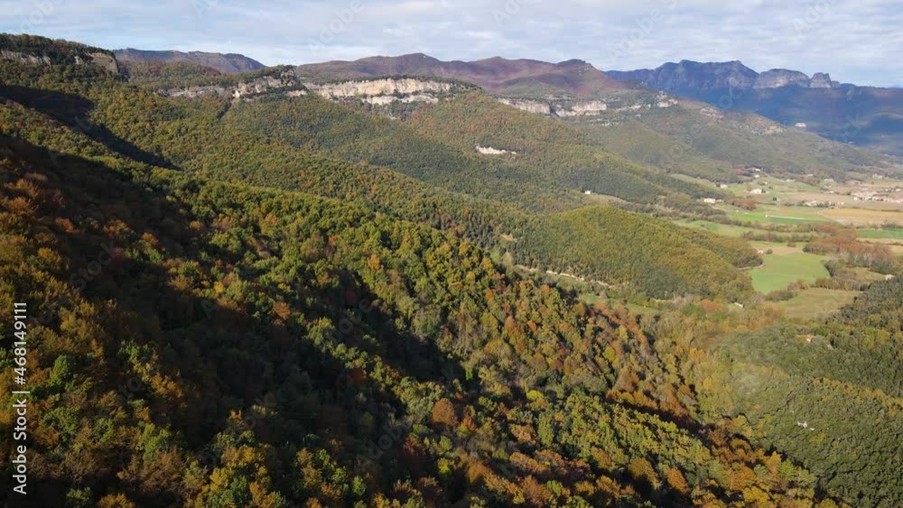 Aerial scene with drone of the autumn landscape in La Vall D En Bas, La Garrotxa, Girona, Spain. 4K UHD
