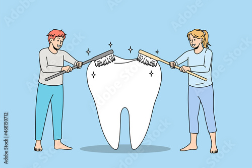 People using toothbrushes cleaning giant tooth take care of oral hygiene. Man and woman cleanse brush teeth. Caries protection. Oralcare, dental treatment concept. Flat vector illustration. 